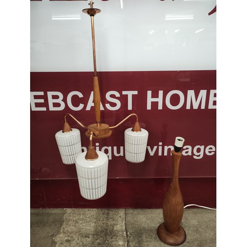 104B - A teak and copper three branch ceiling light and a table lamp