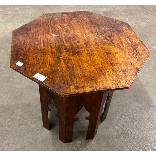 115 - An Arts and Crafts Moorish style beech octagonal occasional table