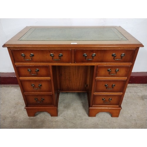 140 - A George I style yew wood kneehole desk