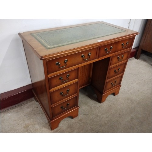 140 - A George I style yew wood kneehole desk