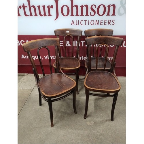 144 - A set of four early 20th Century beech bentwood chairs