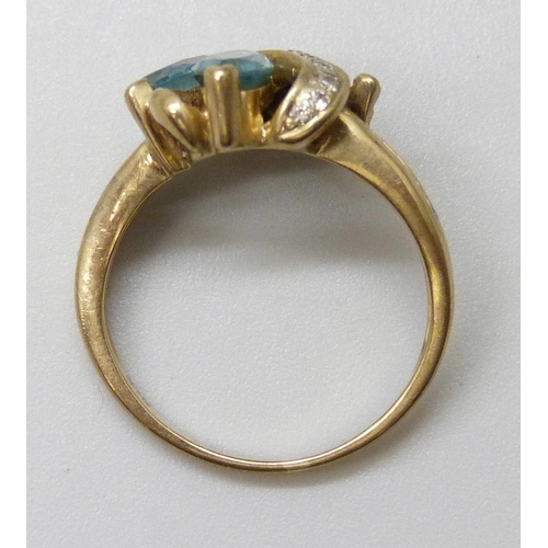 7023 - A 9ct gold ring set with topaz, one stone missing, 3g, K