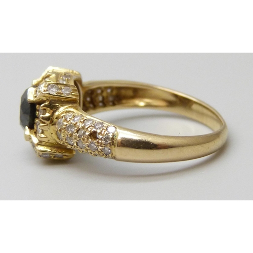 7027 - An 18ct gold and diamond ring, central black stone tests as a diamond, 4.2g, N, (one small diamond m... 