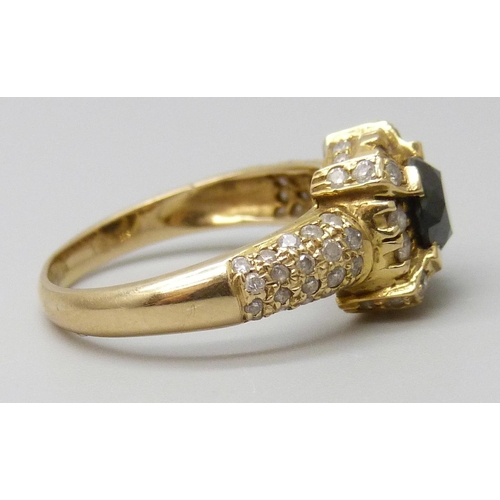 7027 - An 18ct gold and diamond ring, central black stone tests as a diamond, 4.2g, N, (one small diamond m... 