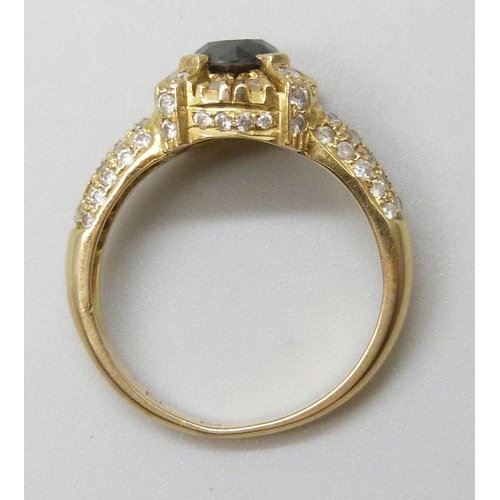 7027 - An 18ct gold and diamond ring, central black stone tests as a diamond, 4.2g, N, (one small diamond m... 