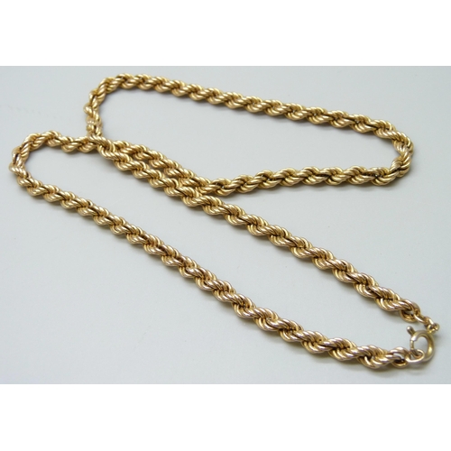 7036 - A 9ct gold rope chain necklace, 16.9g, 51cm