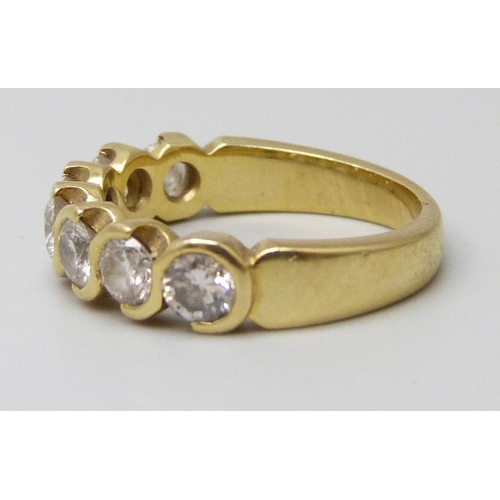 7041 - An 18ct gold seven stone diamond ring, 4.8g, K