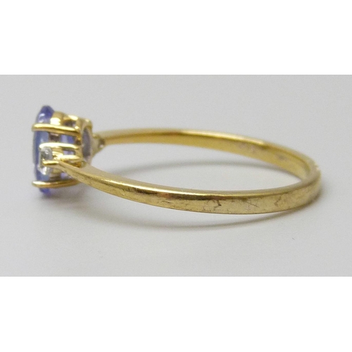 7048 - A silver gilt tanzanite and white stone ring, P