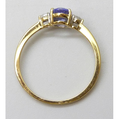 7048 - A silver gilt tanzanite and white stone ring, P