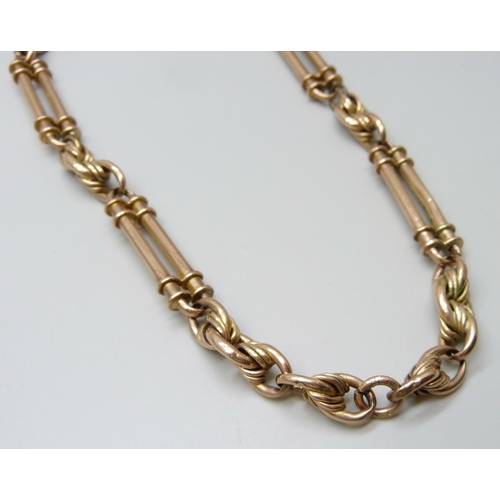 7056 - A 9ct gold fancy link Albert chain, 38g, 38.5cm