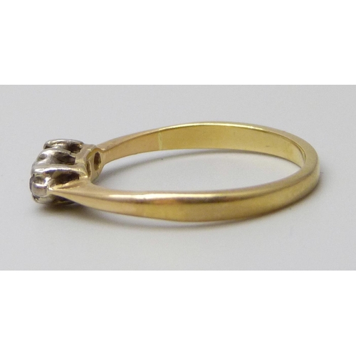 7061 - A yellow metal ring set with three diamonds, 1.9g, J