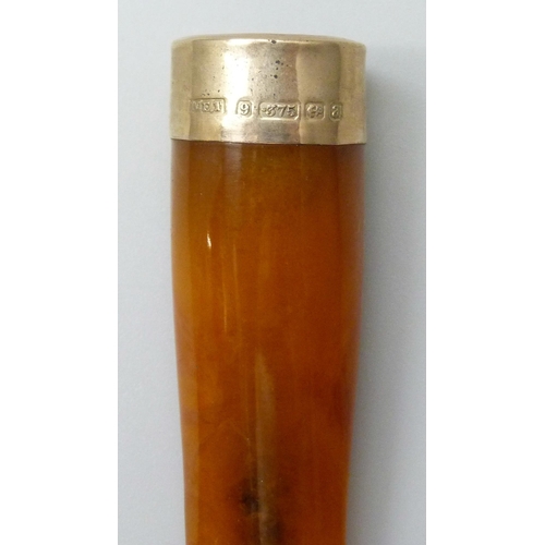 7065 - A 9ct gold mounted cheroot holder