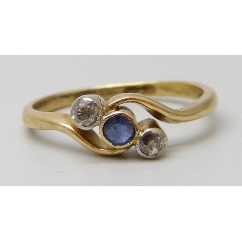 7067 - An 18ct gold, sapphire and diamond ring, 2.4g, M