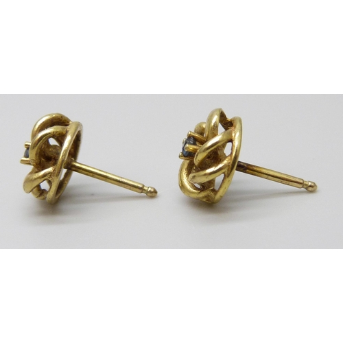 7072 - A pair of 9ct gold stud knot earrings set with blue stones, 1.7g, 8mm