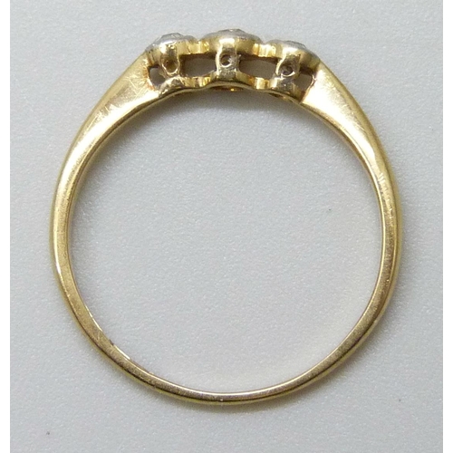 7079 - A yellow metal three stone diamond ring, indecipherable ct mark, 1.6g, M