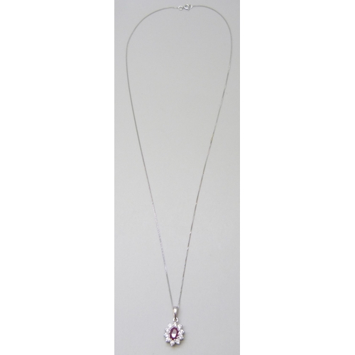 7082 - An 18ct white gold ruby and diamond pendant, approximately .40ct diamonds, on a 9ct white gold chain... 