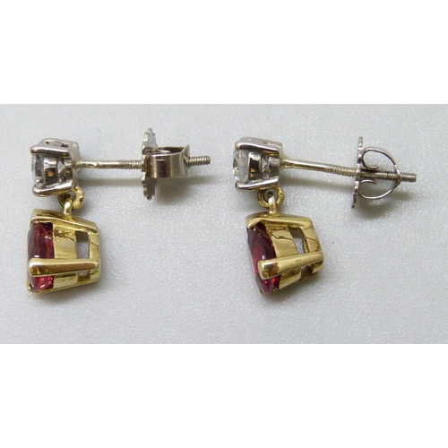 7087 - A pair of 18ct yellow and white gold claw set brilliant cut diamond and pendaloque cut ruby drop ear... 