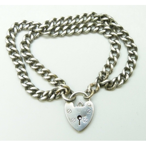 7094 - A silver double curb link bracelet with padlock clasp, 22g