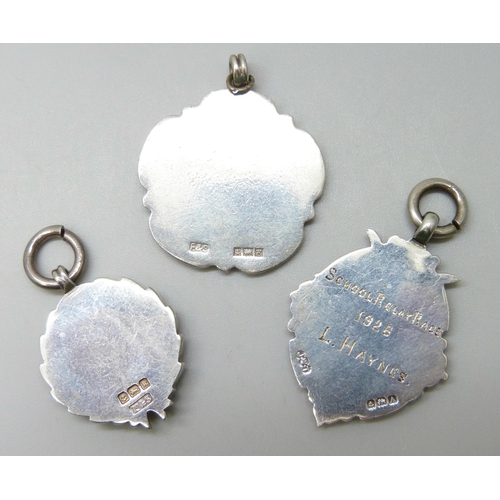 7096 - A silver and enamel bird fob and two others, one with inscription, 28g