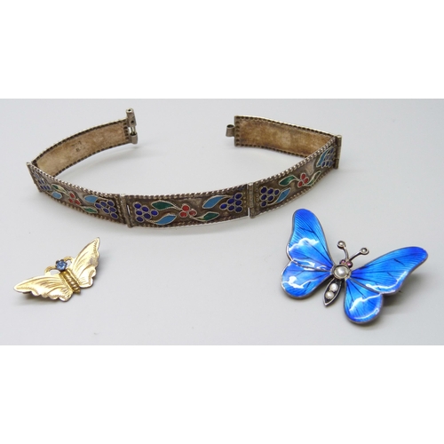 7097 - An early 20th Century enamelled butterfly brooch set with seed pearls, another butterfly brooch and ... 