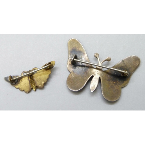 7097 - An early 20th Century enamelled butterfly brooch set with seed pearls, another butterfly brooch and ... 