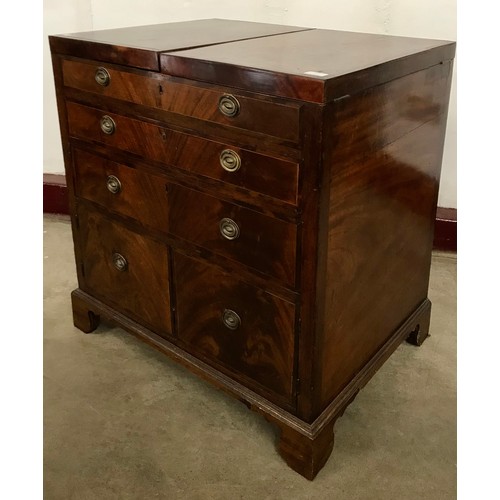 128 - A George III mahogany gentleman's fitted dressing chest