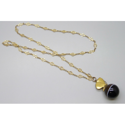 7129 - A large banded agate spherical pendant with butterfly mount, on a fancy link chain