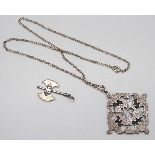 7133 - A silver Brutalist style pendant on chain, together with a silver axe pendant, 19g total