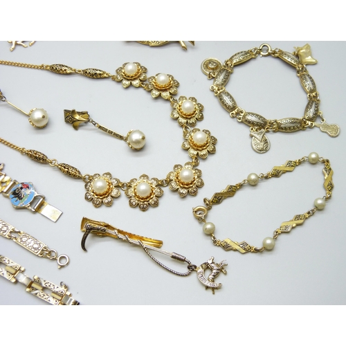 7146 - A collection of costume jewellery including enamelled