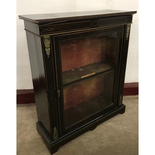 129 - A 19th Century French ebonised and gilt metal mounted pier cabinet