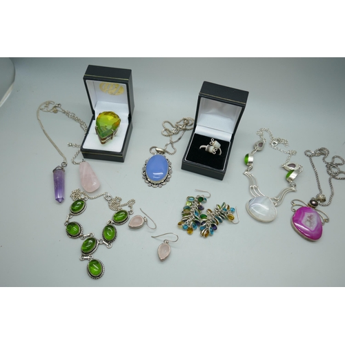 7160 - A collection of costume jewellery including plated pendants, earrings, ring etc.