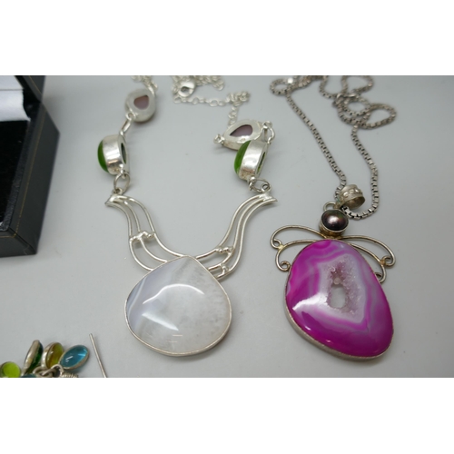 7160 - A collection of costume jewellery including plated pendants, earrings, ring etc.