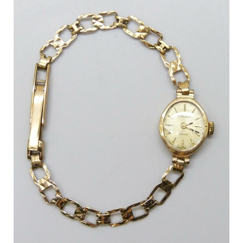 7176 - A 9ct gold cased lady's wristwatch with a 9ct gold strap, 8g total weight including movement