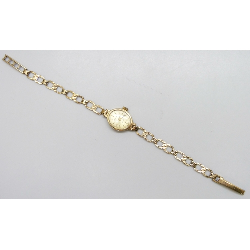 7176 - A 9ct gold cased lady's wristwatch with a 9ct gold strap, 8g total weight including movement