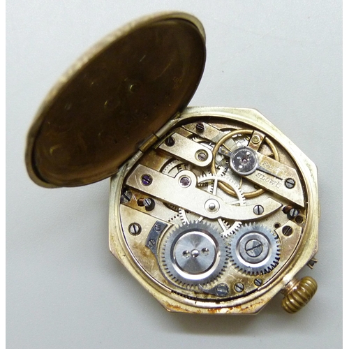 7178 - A 9ct gold fob watch, signs of lugs previously being attached, 22.7g total weight including movement... 