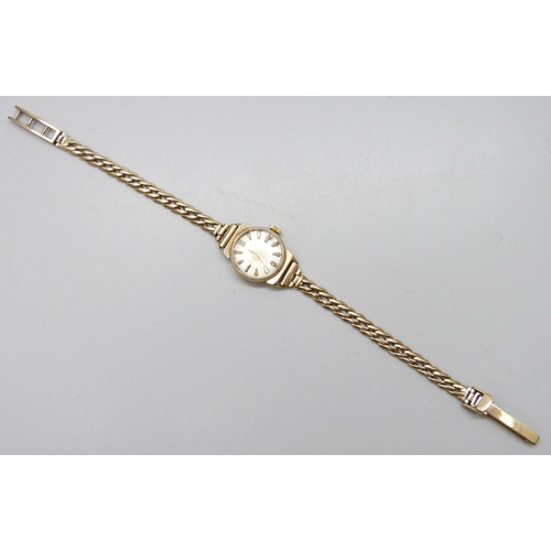 7180 - A 9ct gold lady's wristwatch on a 9ct gold strap, 15.4g total weight including movement