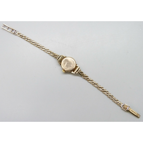 7180 - A 9ct gold lady's wristwatch on a 9ct gold strap, 15.4g total weight including movement