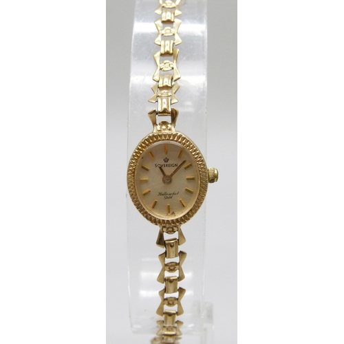 7185 - A 9ct gold lady's wristwatch on a 9ct gold strap, 8.1g total weight