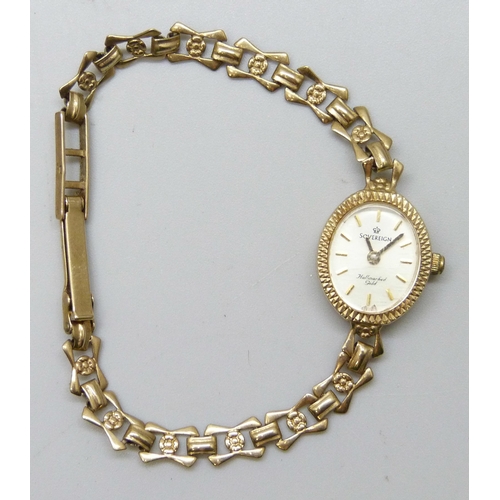 7185 - A 9ct gold lady's wristwatch on a 9ct gold strap, 8.1g total weight