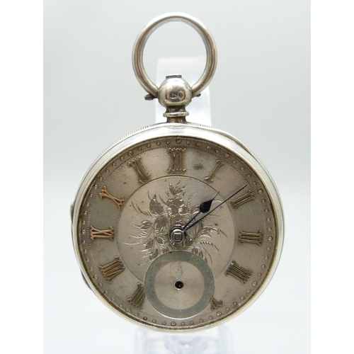 7186 - A silver cased pocket watch, lacking glass, Chester 1882, with an outer case and Smiths stand