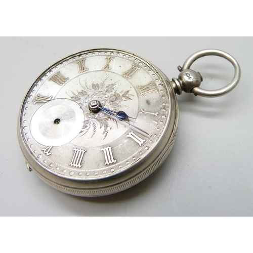 7186 - A silver cased pocket watch, lacking glass, Chester 1882, with an outer case and Smiths stand