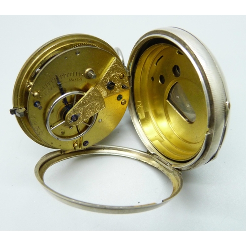 7186 - A silver cased pocket watch, lacking glass, Chester 1882, with an outer case and Smiths stand