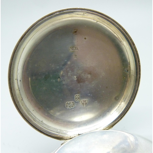 7186 - A silver cased pocket watch, lacking glass, Chester 1882, with an outer case and Smiths stand