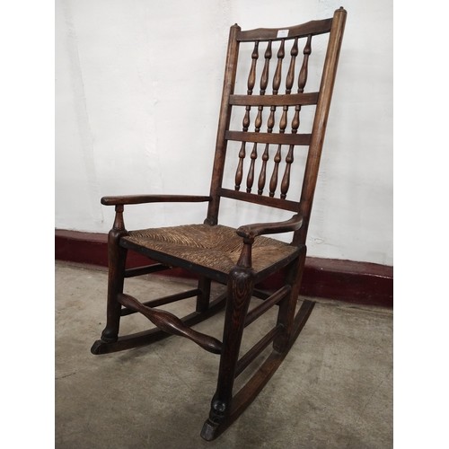 161 - A George III elm and rush seated Macclesfield rocking chair