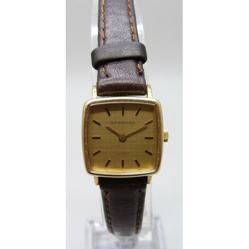 7196 - A 9ct gold cased Garrard wristwatch with inscription to case back, 21mm including crown