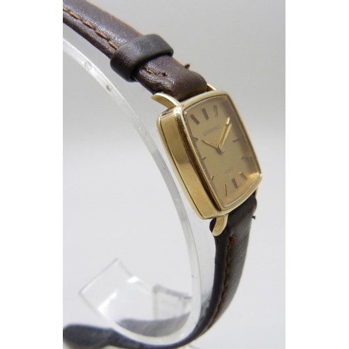 7196 - A 9ct gold cased Garrard wristwatch with inscription to case back, 21mm including crown