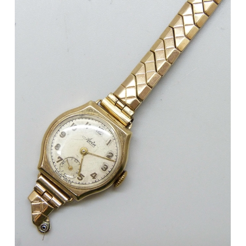 7198 - A 9ct gold lady's Avia wristwatch on a 9ct back and front strap, 22mm case including crown