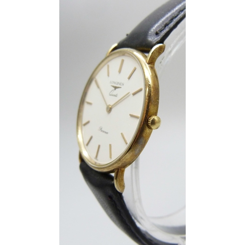 7199 - A Longines 9ct gold cased quartz wristwatch, 33mm including crown, boxed