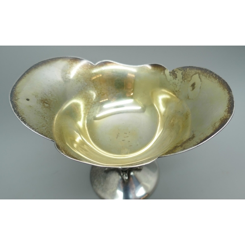 7241 - A silver Arts and Crafts style floral pedestal dish, Birmingham 1976, 164g, 9.5cm tall