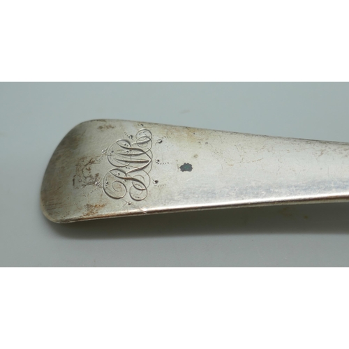 7242 - A George III silver serving spoon, London 1808, and a pair of Georgian silver sugar bows with monogr... 